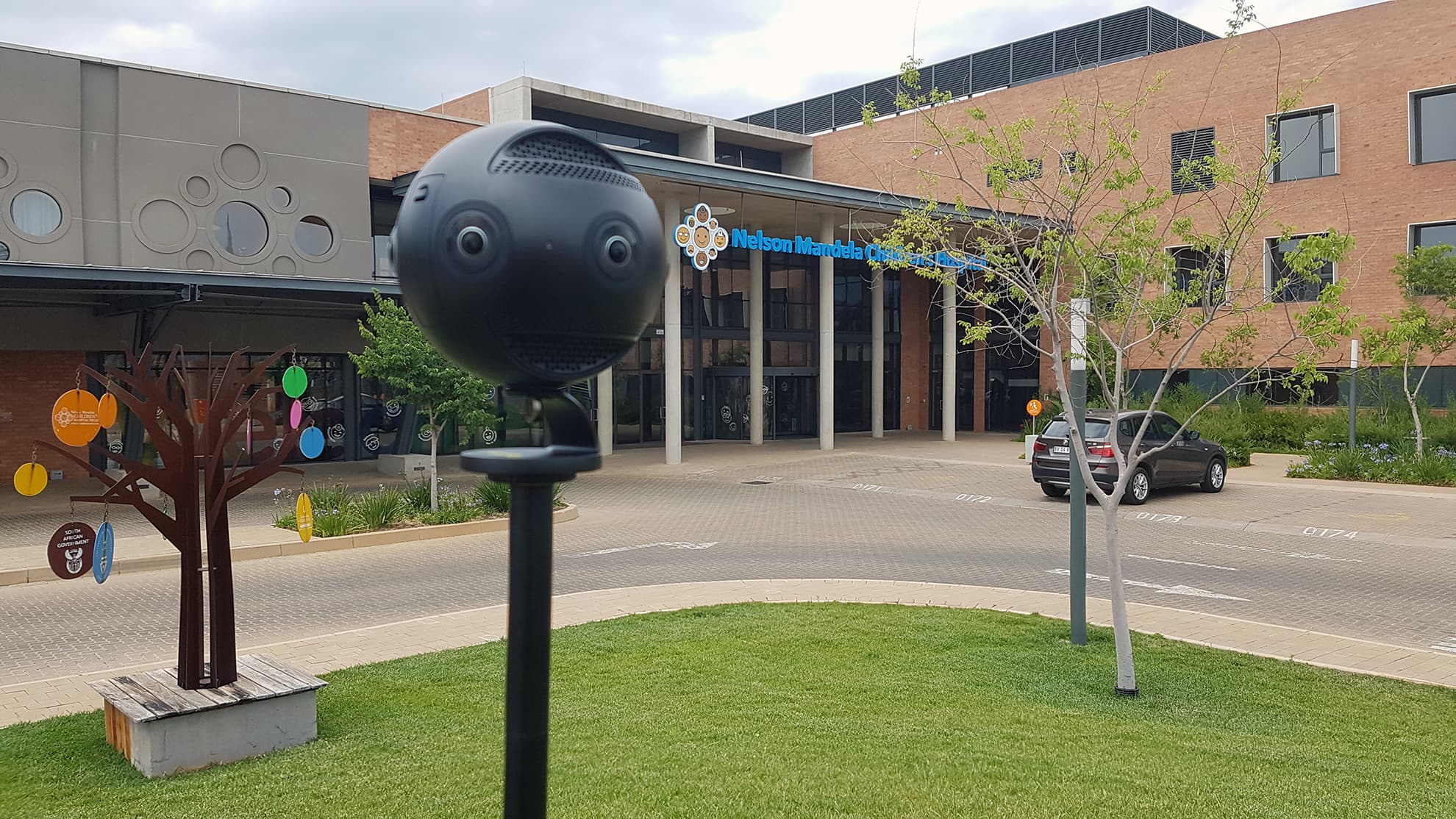 A professional 360-degree camera filming on location