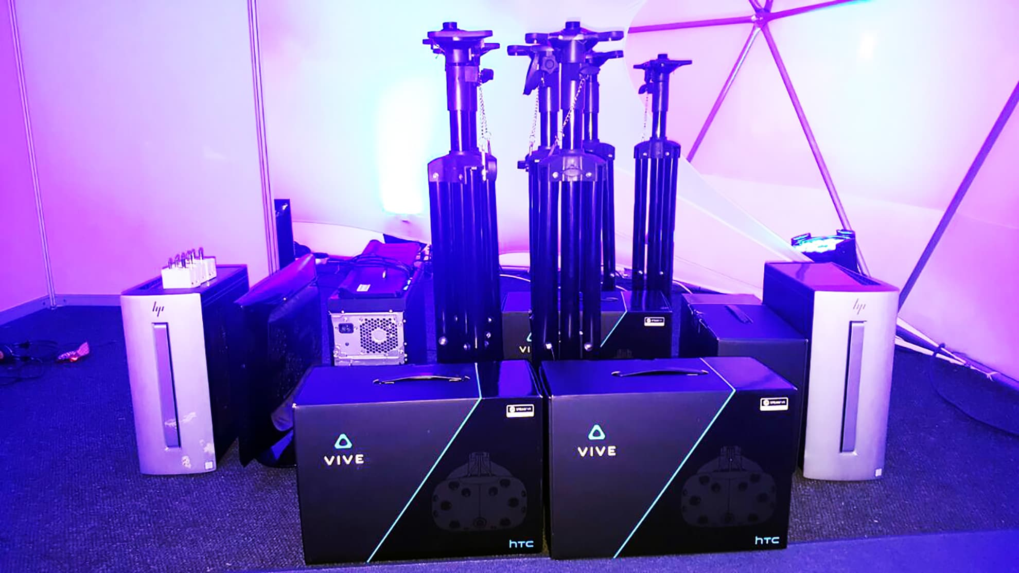Virtual reality headsets, computers and tracking equipment prepared for an event