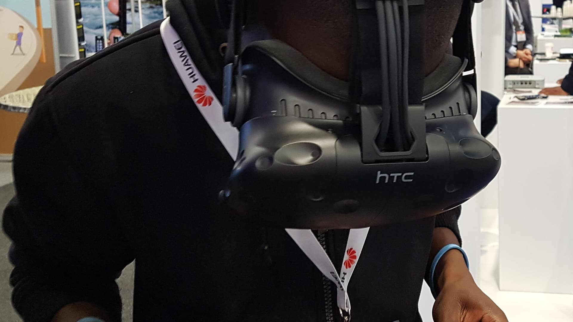 A guest wearing an HTC VIVE headset at a virtual reality activation