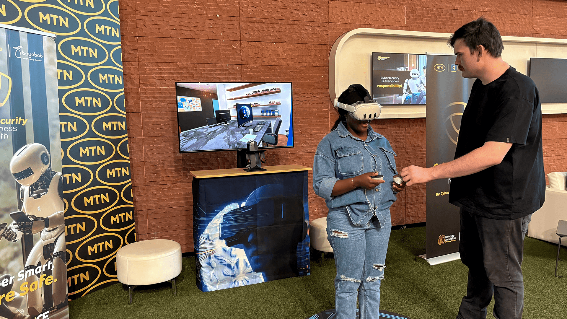A team member guiding a participant through a VR demonstration