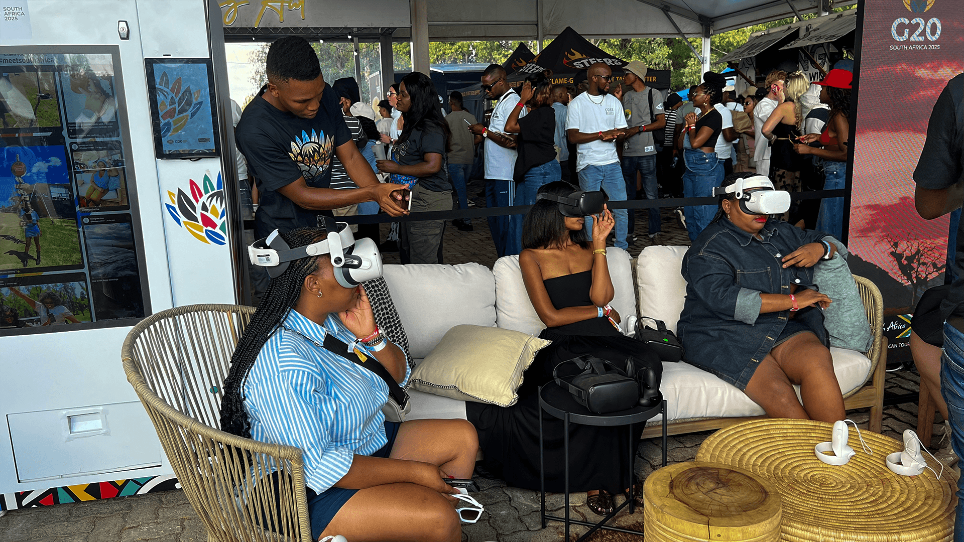 A seated group sharing a virtual reality experience at an exhibition