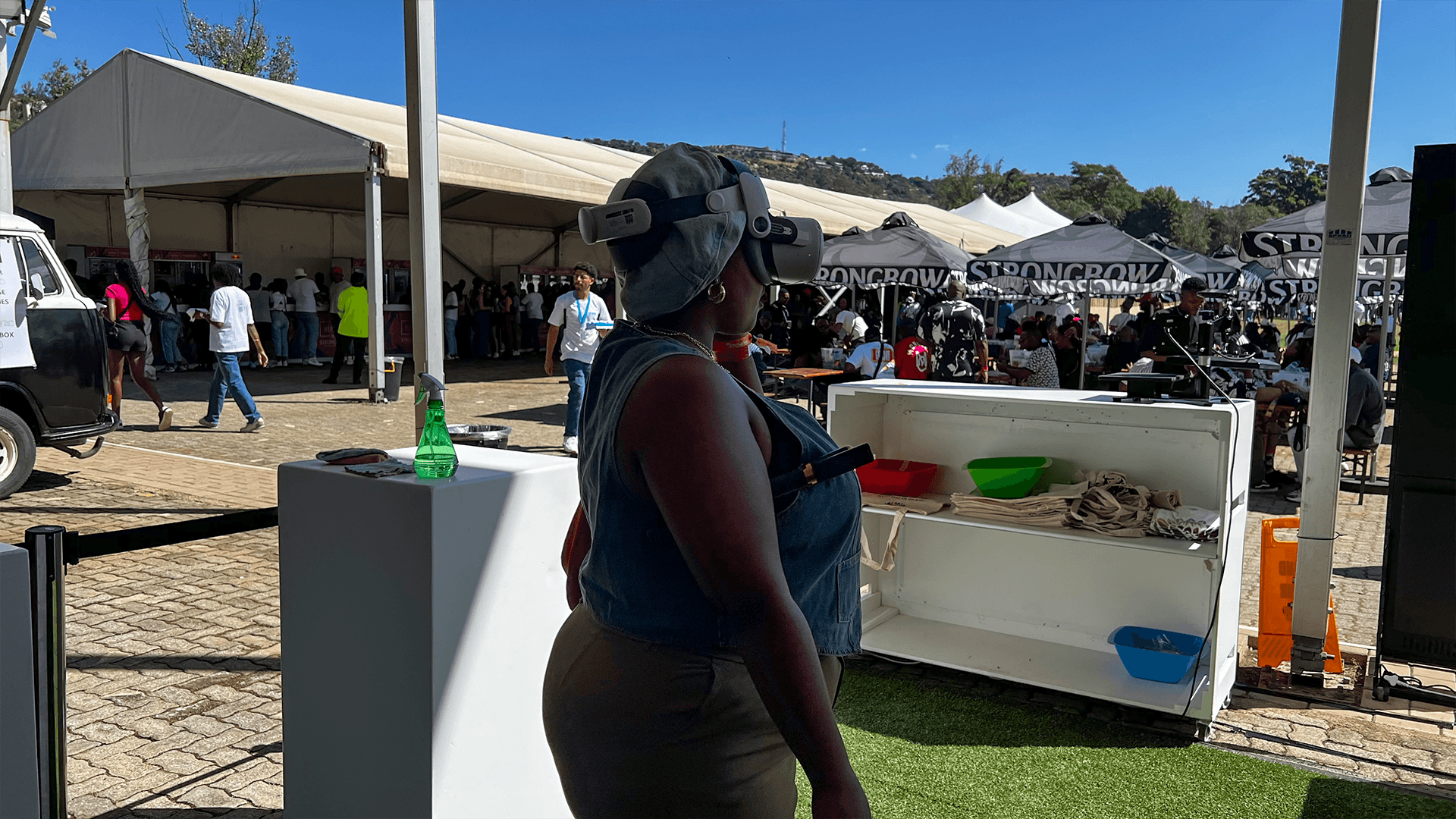 A participant experiencing virtual reality at an outdoor exhibition