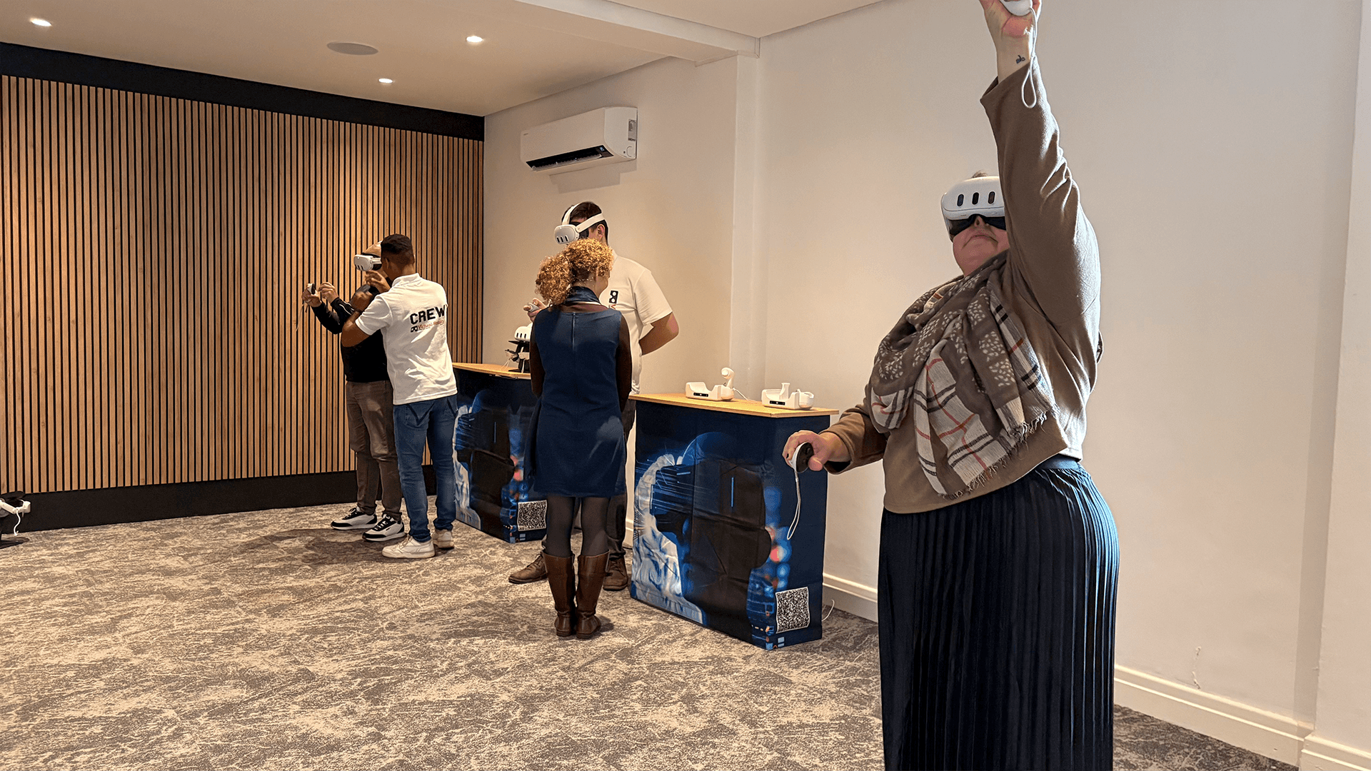Guests raising their controllers during a virtual reality activity