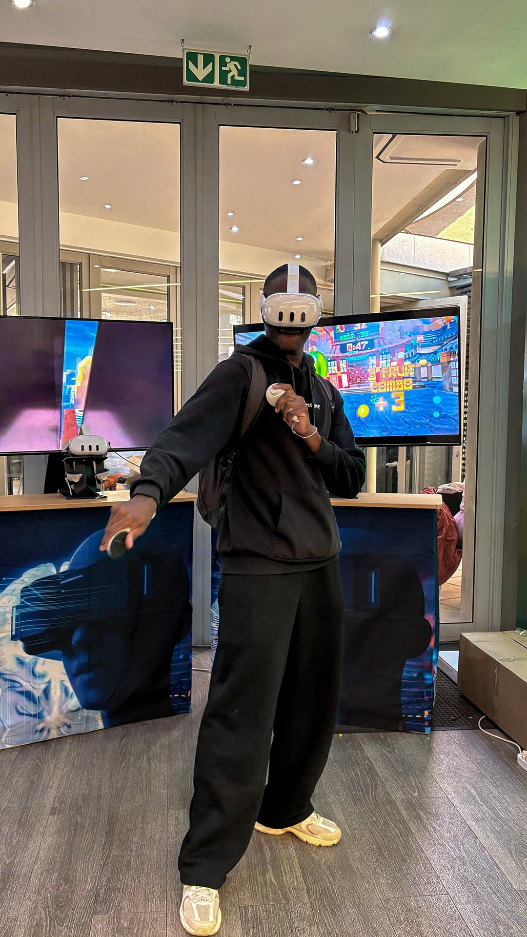 A guest stretching an arm outward during a virtual reality activity