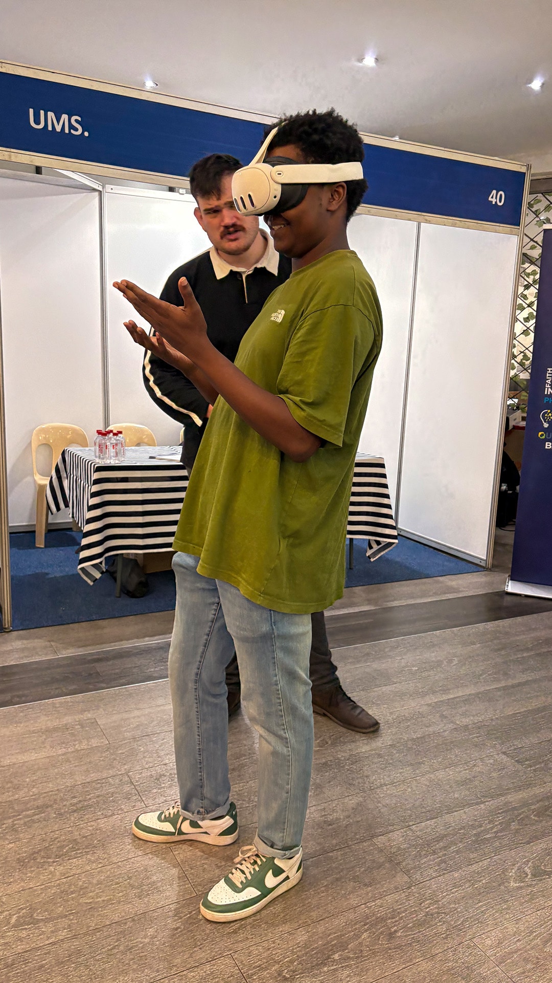 A guest enjoying a virtual reality activity while spectators watch
