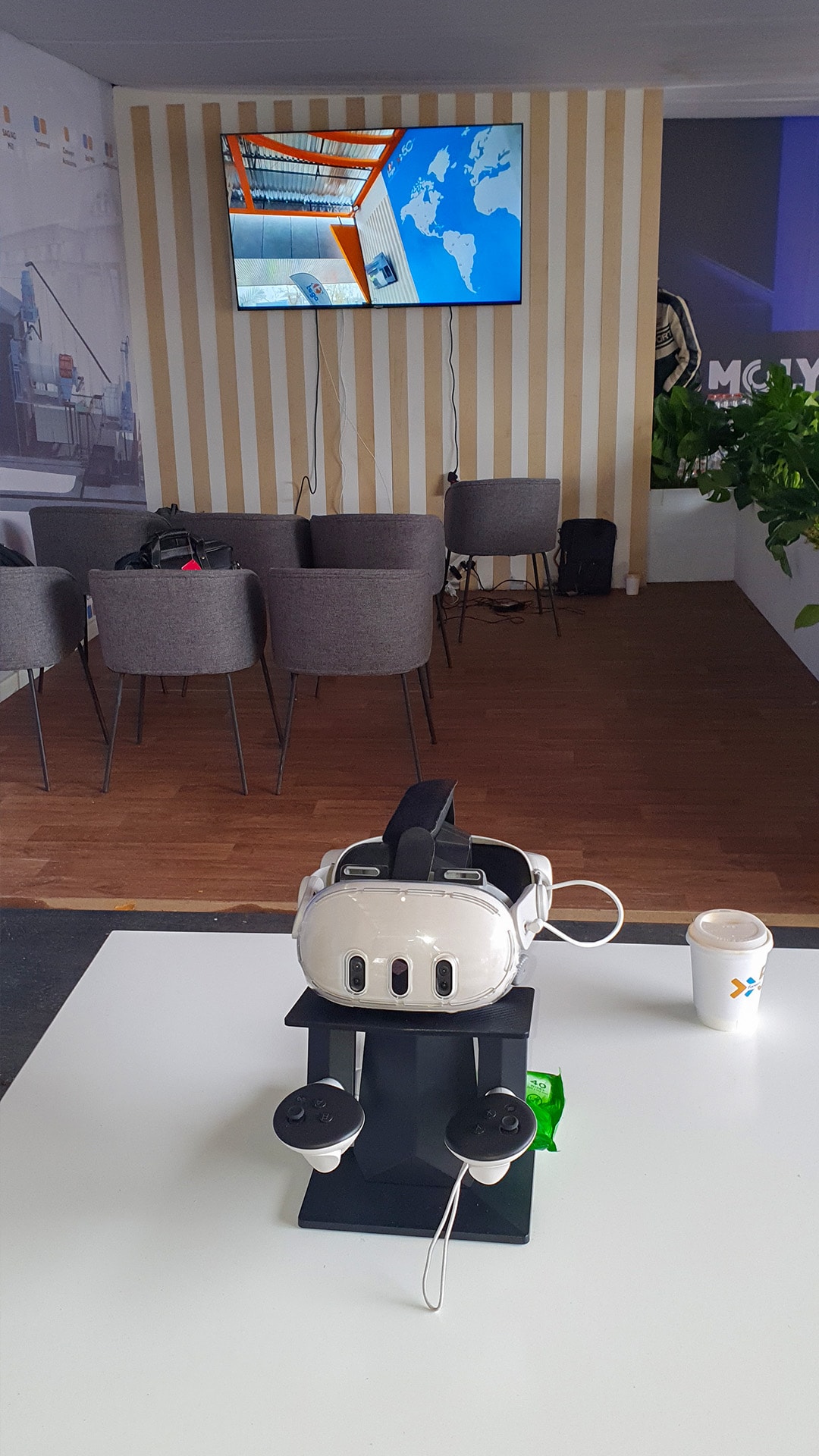 A virtual reality headset displayed on a table at an event