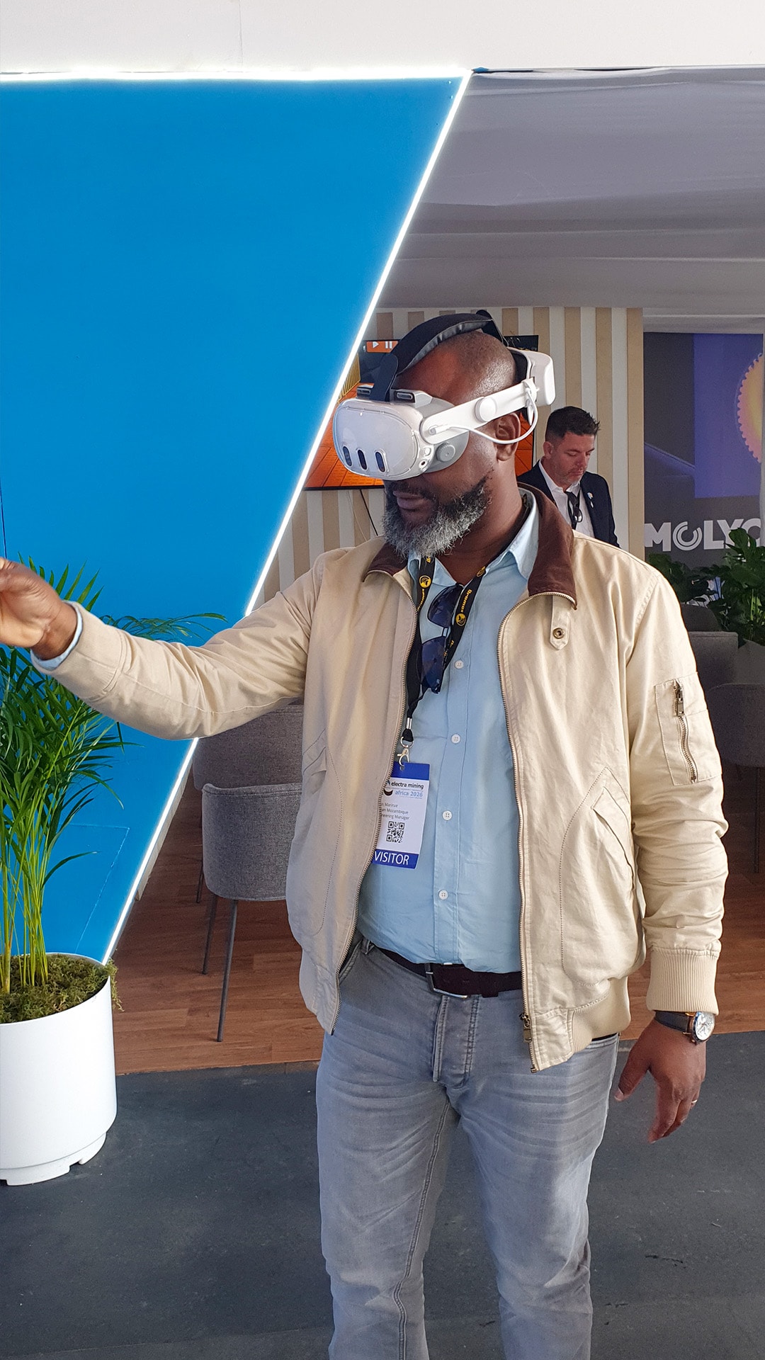 A participant reaching outward during a virtual reality demonstration