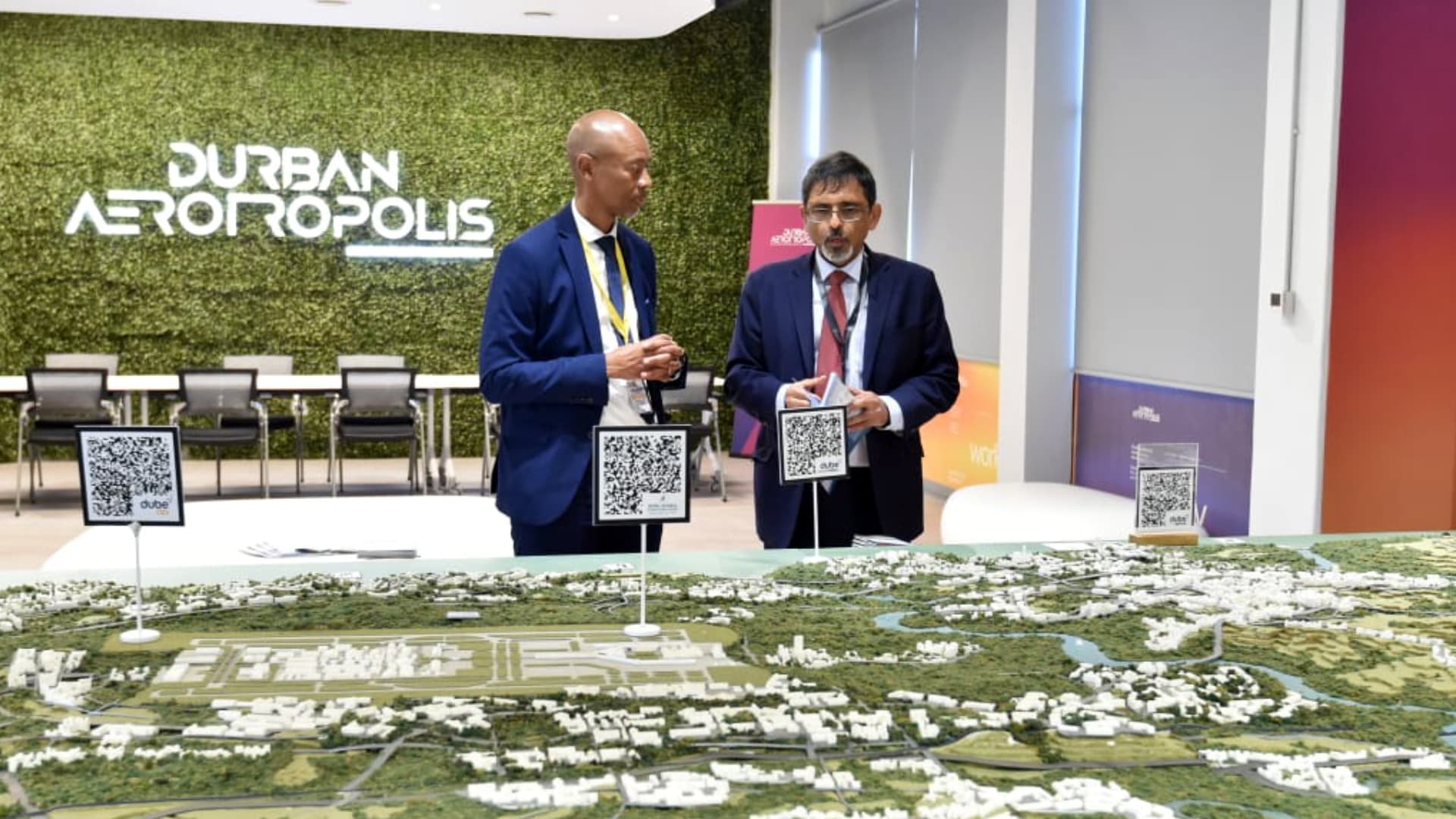 Ebrahim Patel and another attendee beside the Durban Aerotropolis model at the launch
