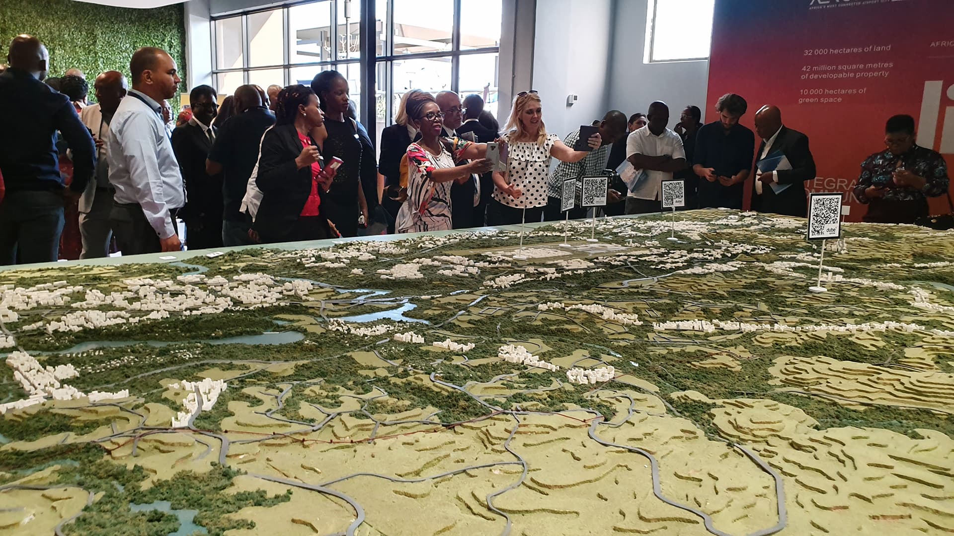 Launch guests gathered around the large Durban Aerotropolis model and its map markers